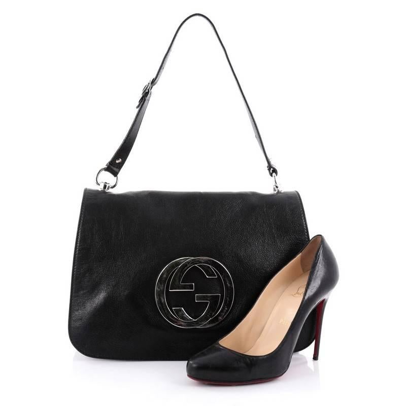 This authentic Gucci Blondie Flap Shoulder bag Leather Medium is perfect for on-the-go fashionistas. Crafted from black leather, this iconic chic bag features adjustable leather shoulder strap with buckle details, large interlocking Gucci GG logo at