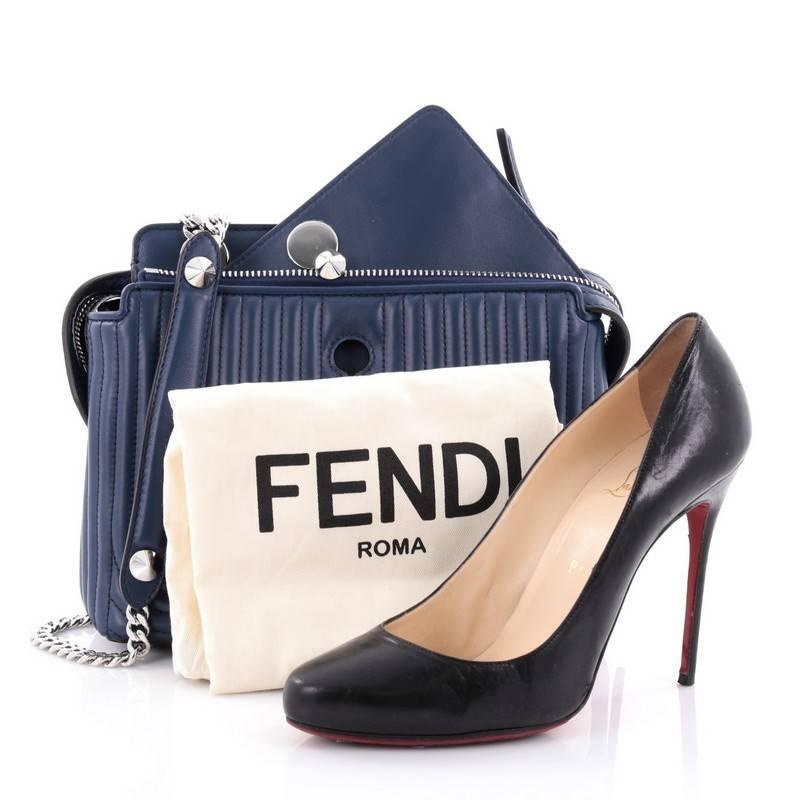 This authentic Fendi DotCom Click Top Handle Bag Quilted Leather Small is a chic and minimalist bag perfect for your everyday looks. Crafted from blue geometric-quilted leather, this stylish bag features chain-link shoulder strap, two zip top