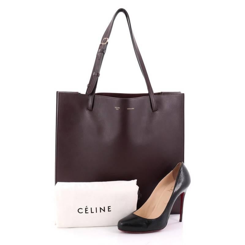 This authentic Celine Triple Shopper Tote Smooth Calfskin is the perfect shopper tote with urban chic design from the brands Fall 2013 collection. Crafted from dark burgundy smooth calfskin leather, this sleek tote features adjustable leather