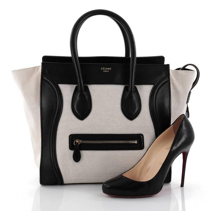 This authentic Celine Luggage Handbag Canvas and Leather Mini is one of the most sought-after bags beloved by fashionistas. Crafted from off-white canvas and black leather, this minimalist tote features dual-rolled handles, an exterior front pocket,
