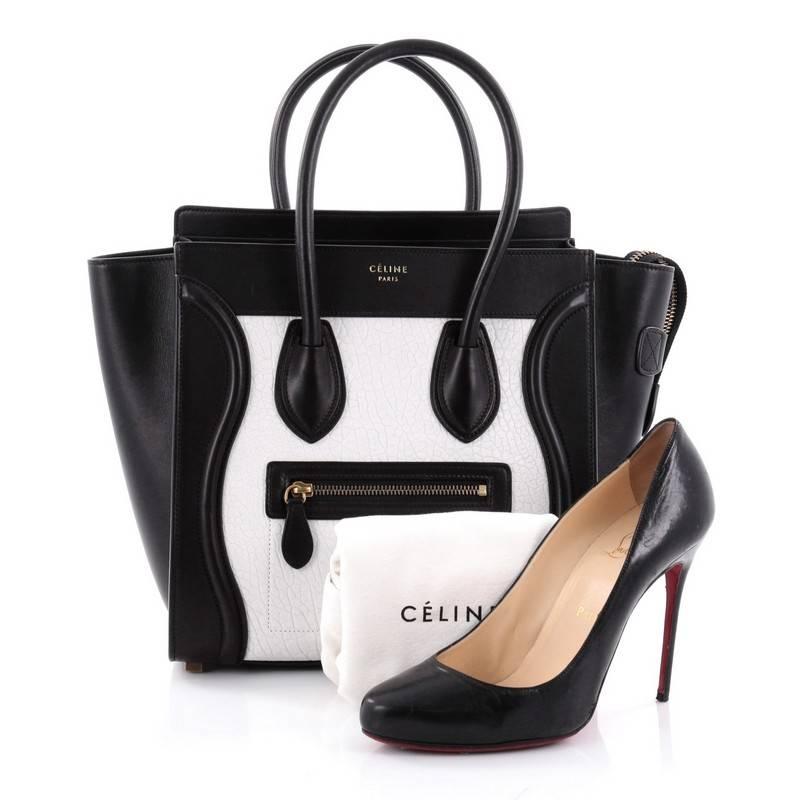 This authentic Celine Bicolor Luggage Handbag Leather Micro showcases an elegant day-to-day style essential for any fashionista. Constructed in bicolor black smooth leather with white grainy leather, this popular tote features an exterior front zip