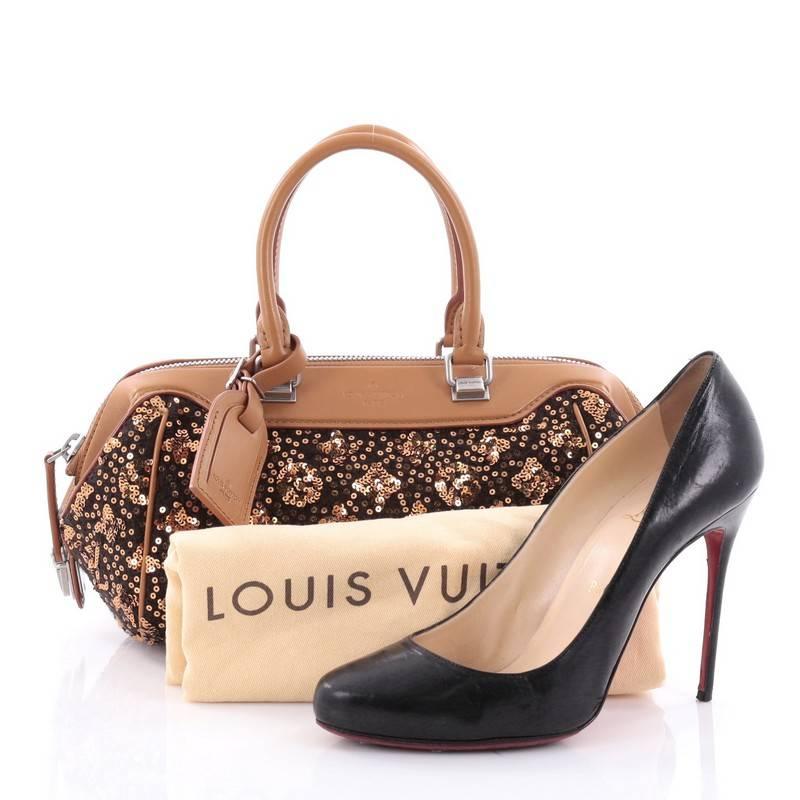 This authentic Louis Vuitton Baby Speedy Bag Limited Edition Sunshine Express, created by Marc Jacobs for LV's Fall 2012/2013 collection, is crafted using brown wool and luminous gold sequins forming the house's world-famous monogram. This
