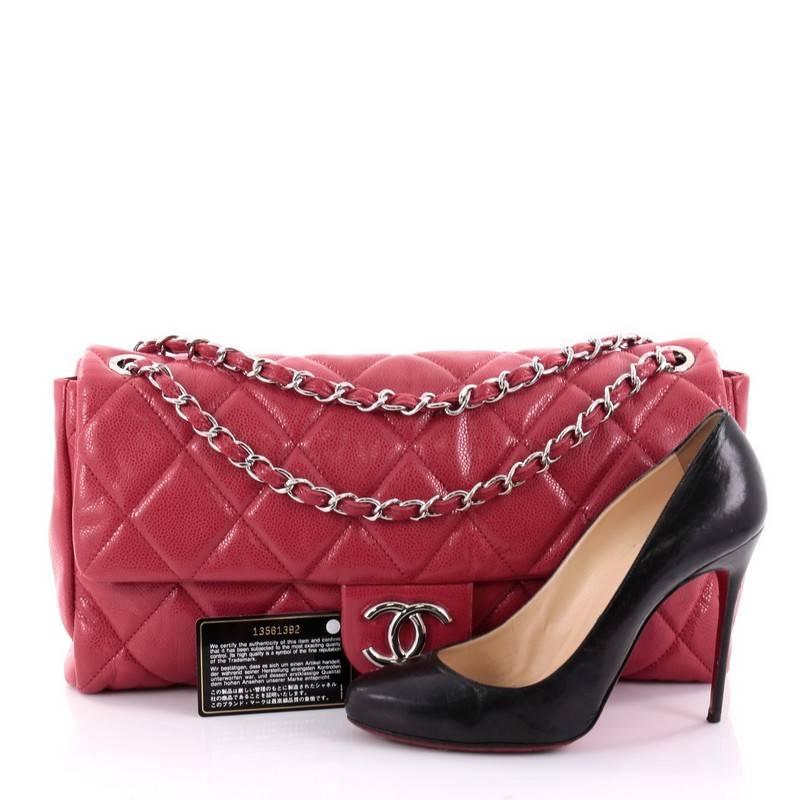 This authentic Chanel Nature Flap Bag Quilted Glazed Caviar Large presented in the brand's 2010 Collection mixes classic Chanel style with casual-chic flair. Crafted from beautiful pink caviar leather, this shiny, textured flap features Chanel's