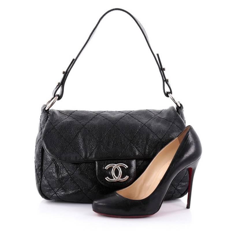 This authentic Chanel On the Road Flap Bag Quilted Leather Small is a classic and timeless design perfect for modern woman. Crafted from black quilted leather, this easy-to-carry flap bag features interlocking CC logo at its frontal flap, flat