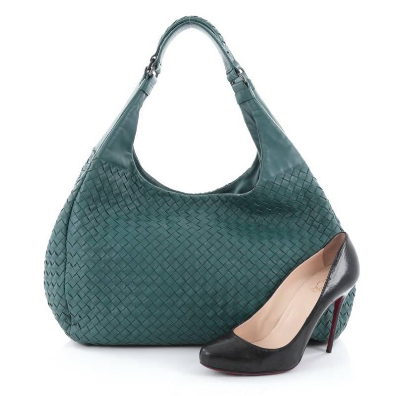 This authentic Bottega Veneta Campana Hobo Intrecciato Nappa Large is both understated yet elegant perfect for the modern woman. Crafted in Bottega Veneta's signature intrecciato woven teal intrecciato nappa leather, this functional shoulder bag