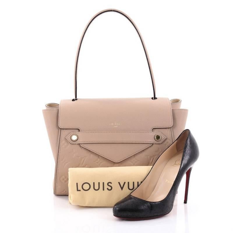 This authentic Louis Vuitton Trocadero Handbag Monogram Empreinte Leather named after a chic Parisian neighborhood is functional and elegant. Crafted from nude monogram empriente leather, this sophisticated bag features a looping end to end top