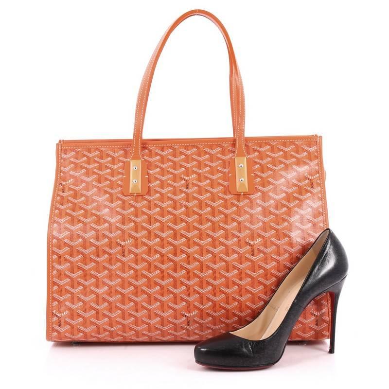 This authentic Goyard Marquises Handbag Coated Canvas is a luxurious and timeless tote personifying the brand's iconic style made for everyday excursions. Crafted from orange goyard coated canvas, this chic, soft-structured tote features dual-flat