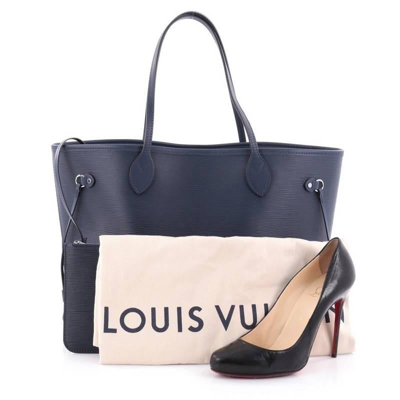 This authentic Louis Vuitton Neverfull Tote Epi Leather MM is a perfect companion for daily excursions. Crafted in navy epi leather, this iconic, easy-to-carry tote features dual flat leather handles, side tassels that cinches and expands and