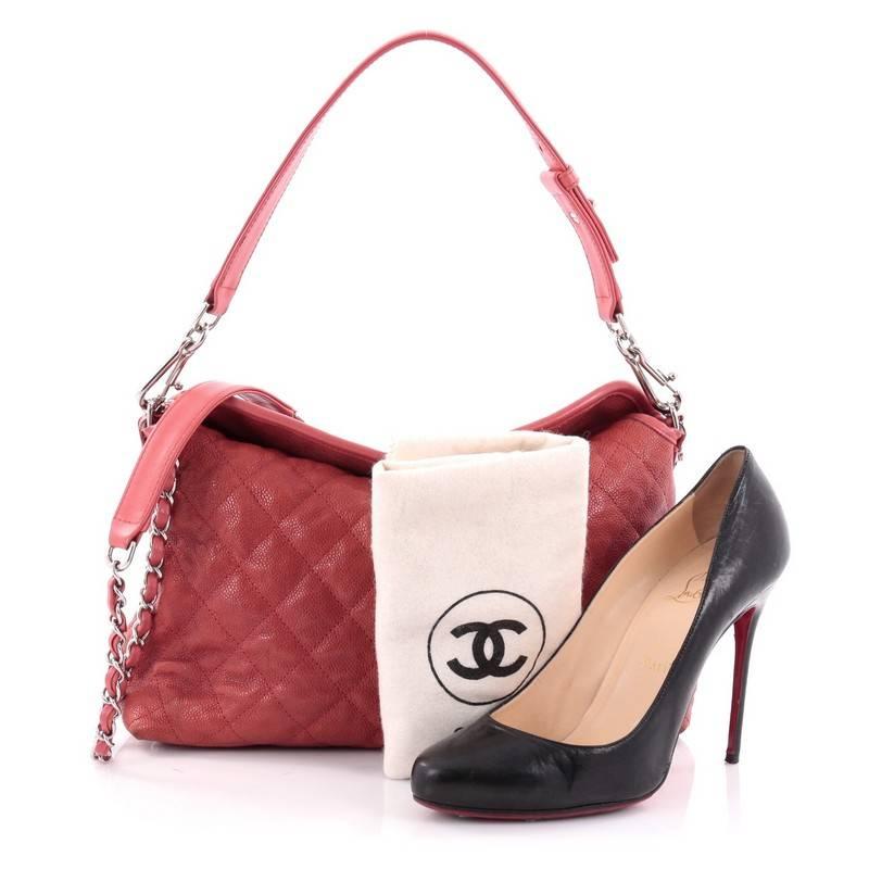 This authentic Chanel French Riviera Tote Quilted Caviar Small showcases a subtly modern yet classic design made for the modern woman. Crafted in red quilted caviar leather, this luxurious tote features woven-in leather chain straps with leather