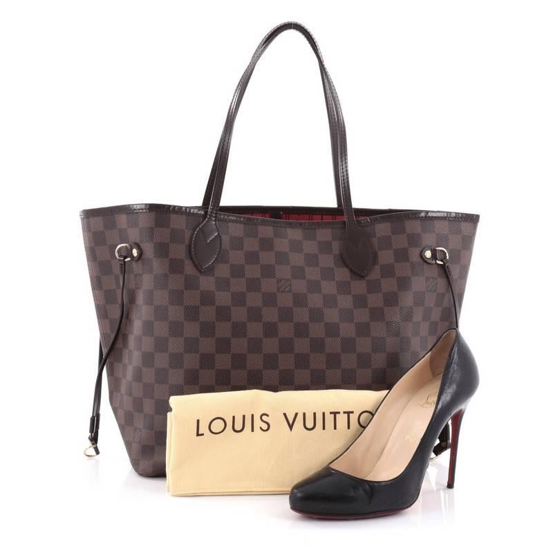 This authentic Louis Vuitton Neverfull Tote Damier MM is a popular and practical tote beloved by many. Constructed with Louis Vuitton's signature damier ebene coated canvas, this tote is spacious and structured without being bulky. The side laces
