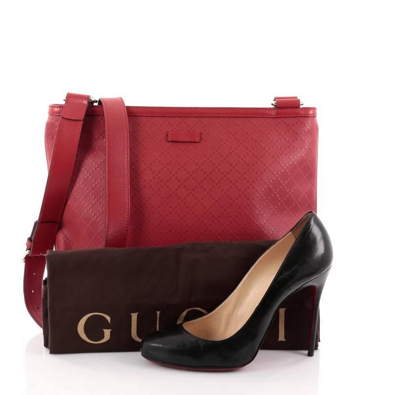 This authentic Gucci Crossbody Bag Diamante Leather Large is a marvelous messenger that is ideal for day with the sophisticated style. Crafted from red diamante leather, this messenger bag features an adjustable leather crossbody strap with gold