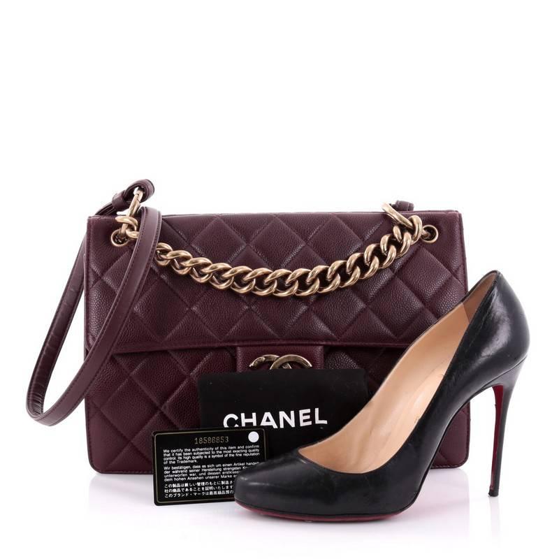 This authentic Chanel Retro Class Flap Bag Quilted Caviar Large is a stylish and functional bag that makes a perfect everyday bag. Crafted in eggplant quilted caviar leather, this bag features chunky chain-link top handle, long smooth leather strap