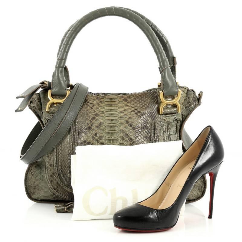 This authentic Chloe Marcie Satchel Python Medium is perfect for an on-the-go fashionista. Constructed from genuine green python skin, this ultra-chic, luxurious satchel features wrapped leather handles, horseshoe stitched front flap, pebbled