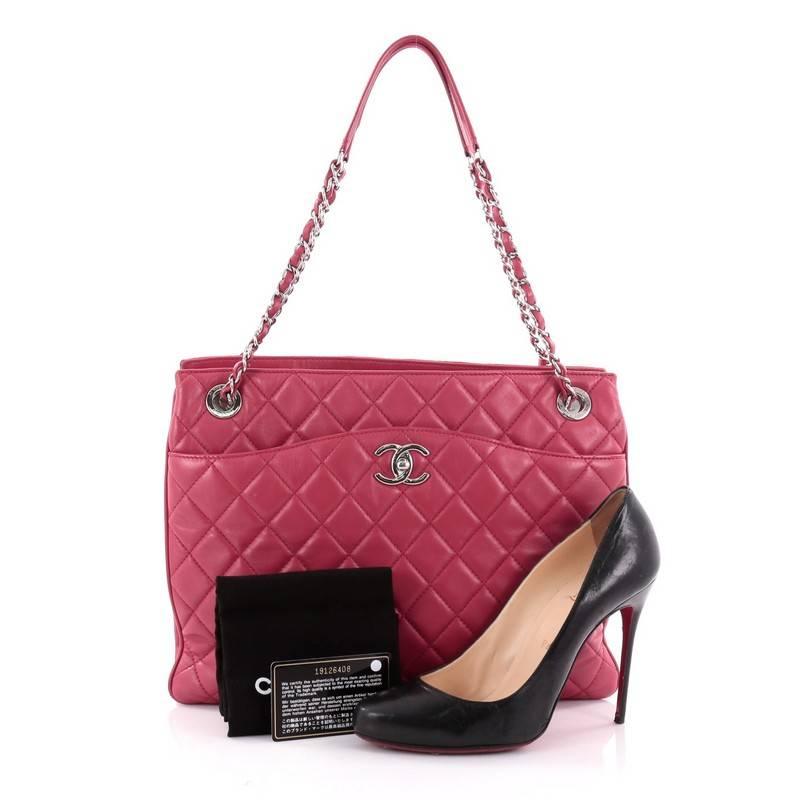 This authentic Chanel 3 Tote Quilted Lambskin Medium presents a classic and timeless style made for any fashionista. Constructed in dark pink diamond quilted lambskin leather, this chic tote features a soft, easy-to-carry silhouette, woven-in