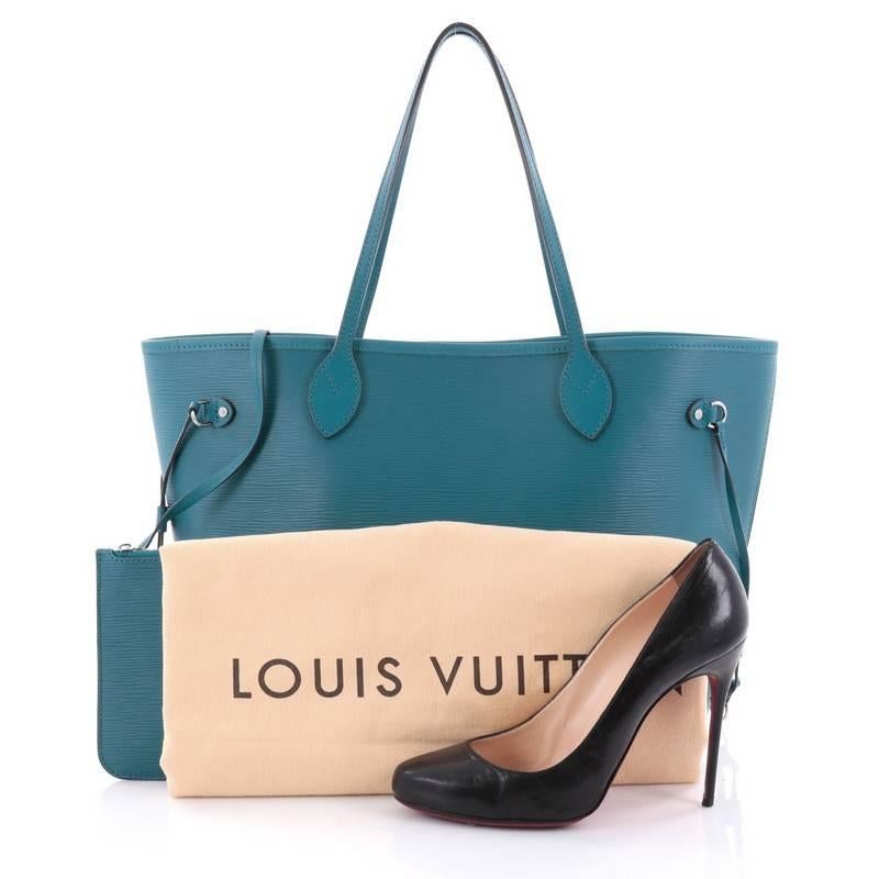 This authentic Louis Vuitton Neverfull Tote Epi Leather MM is a perfect companion for daily excursions. Crafted in turquoise epi leather, this iconic, easy-to-carry tote features dual flat leather handles, side tassels that cinches and expands and