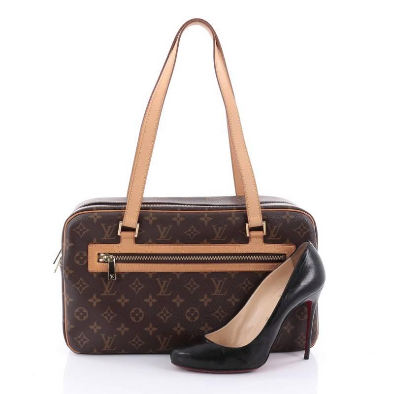 This authentic Louis Vuitton Cite Handbag Monogram Canvas GM showcases a simple design made for everyday use. Crafted from brown monogram coated canvas, this bag features dual flat cowhide shoulder strap, vachetta leather trims, exterior zip pocket,