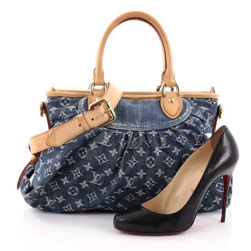 This authentic Louis Vuitton Neo Cabby Handbag Denim MM is a modern twist on the classic LV style. Crafted from blue stonewashed LV monogram denim, this tote features dual-rolled vachetta leather top handles, pleated details, buckled sides,