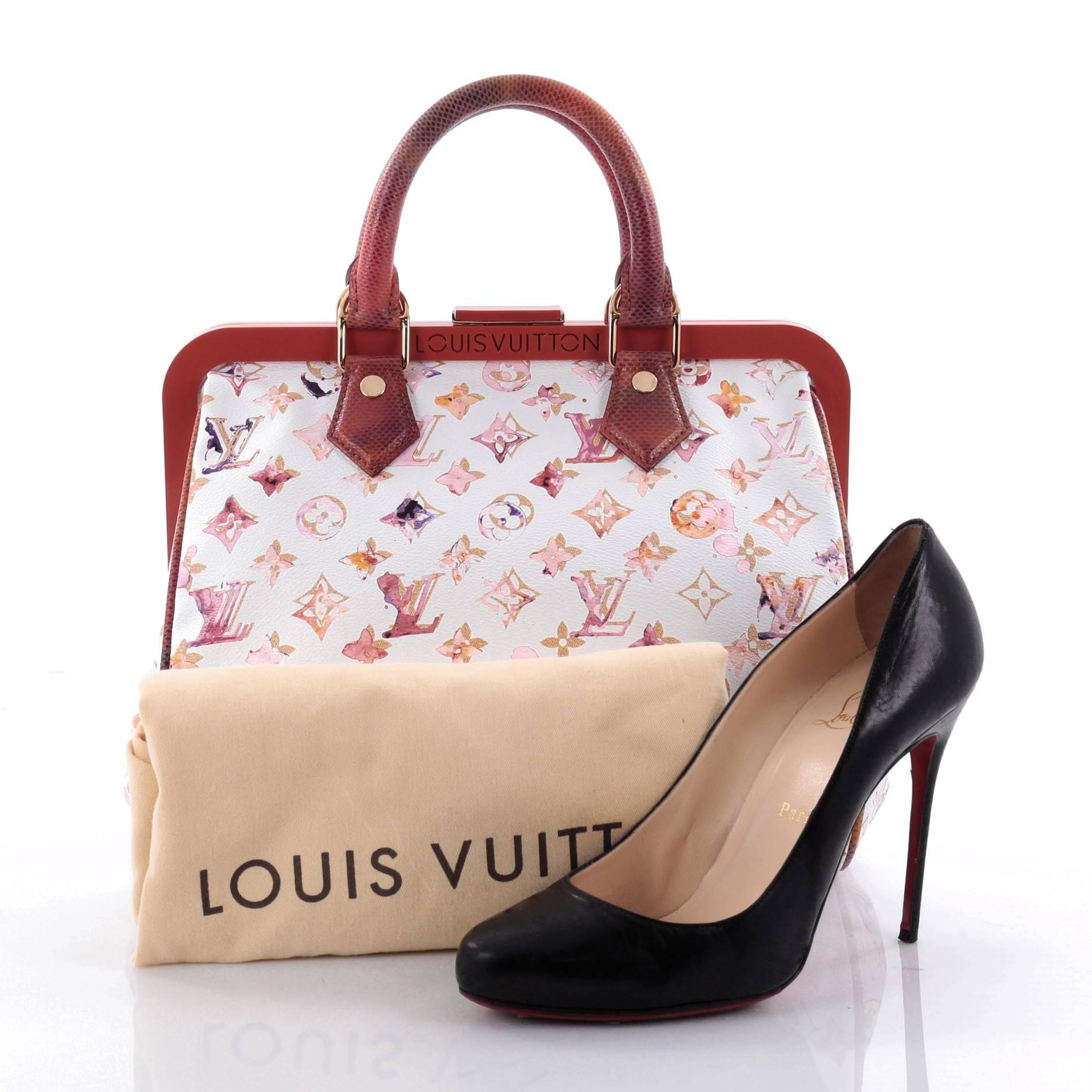 This authentic Louis Vuitton Frame Speedy Bag Limited Edition Aquarelle Monogram Canvas 30 is an ultra-rare piece first seen on the runway of Marc Jacob's Spring/Summer 2008 Collection. Crafted from pink and white monogram watercolor canvas with