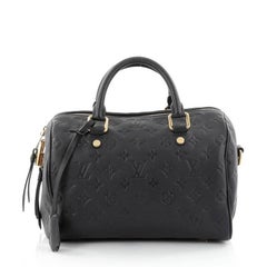 Louis Vuitton Bi-Color Black/Cream Monogram Empreinte Leather Speedy 25  Bandouliere Bag - Yoogi's Closet