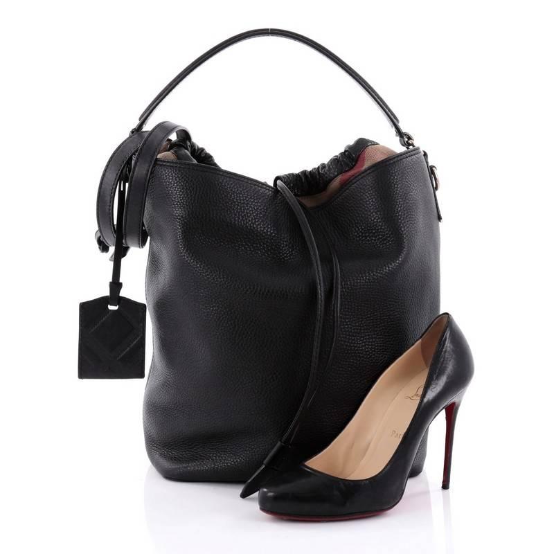This authentic Burberry Susanna Hobo Leather Medium in minimalist design is ideal for everyday use. Crafted in black leather with Burberry's iconic canvas check trim, this relaxed yet chic hobo features a simple bucket-style silhouette, single