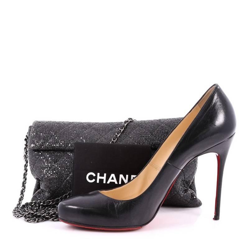 This authentic Chanel Chain Clutch Quilted Sequin from 2014 is both chic and practical. Crafted in black sequin, this stunnning clutch features the unmistakable Chanel quilted design, detachable and delicate woven-in leather chain strap and
