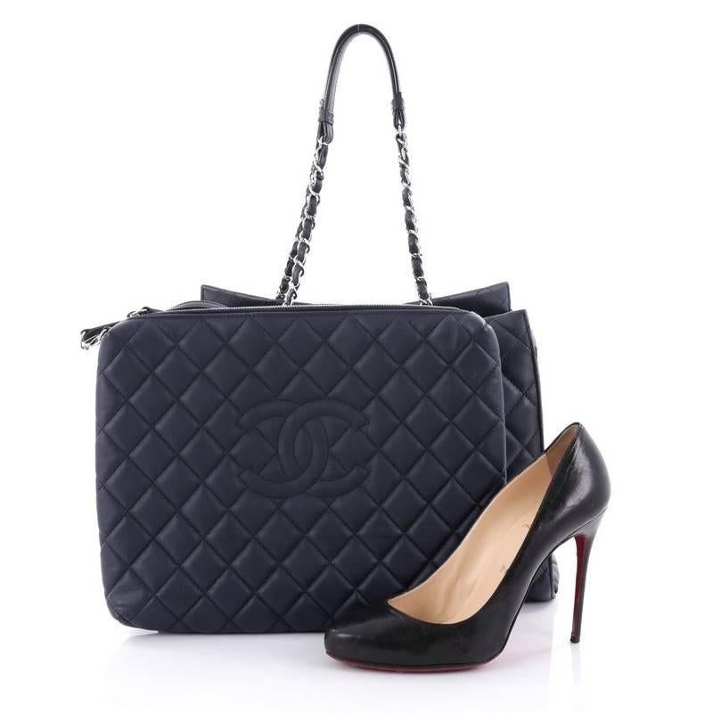 This authentic Chanel Chic and Soft Shopping Tote Quilted Calfskin Large presents a classic and timeless style. Constructed in luxurious navy blue diamond quilted calfskin leather, this chic tote features a soft, easy-to-carry silhouette, iconic CC