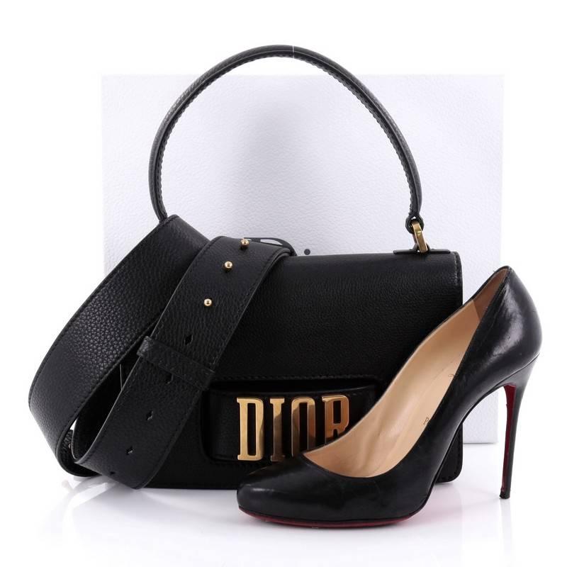This authentic Christian Dior Dio(r)evolution Top Handle Flap Bag Leather Medium from the Spring/Summer 2017 Collection is a break from Dior’s feminine style, with its edgy and trendy look. Crafted in black grained leather, this ultra chic bag