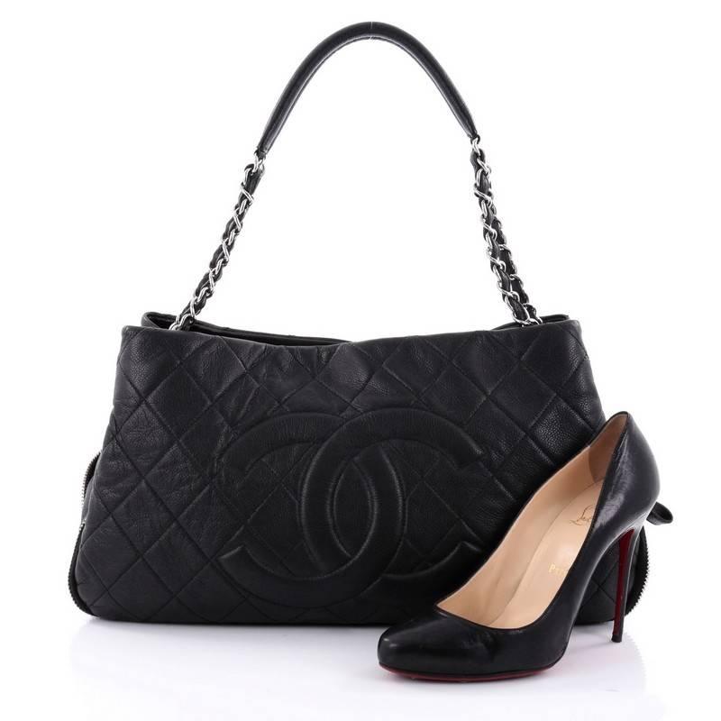 This authentic Chanel Timeless CC Expandable Tote Quilted Caviar Medium mixes modern style and versatility that will complement a multitude of looks. Crafted from black caviar leather, this unique tote features Chanel's iconic diamond quilting,