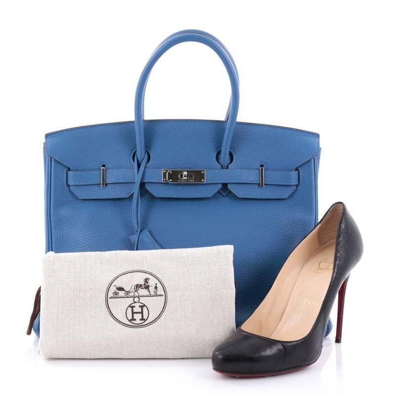 This authentic Hermes Birkin Handbag Mykonos Togo with Palladium Hardware 35 stands as one of the most-coveted bags fit for any fashionista. Constructed from sturdy, scratch-resistant mykonos blue togo leather, this stand-out oversized tote features