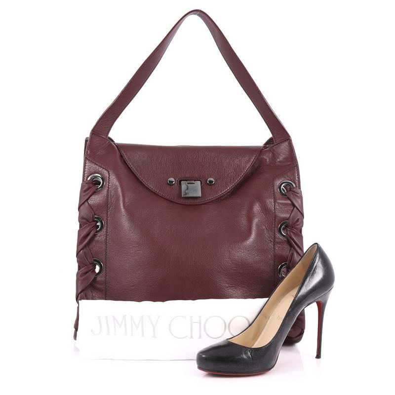 This authentic Jimmy Choo Rion Tote Leather is a stylish and fresh design perfect to add to your collection. Crafted in plum leather, this tote features dual flat looping leather handles, distinctive whipstitch detailing that adorns the edges of the