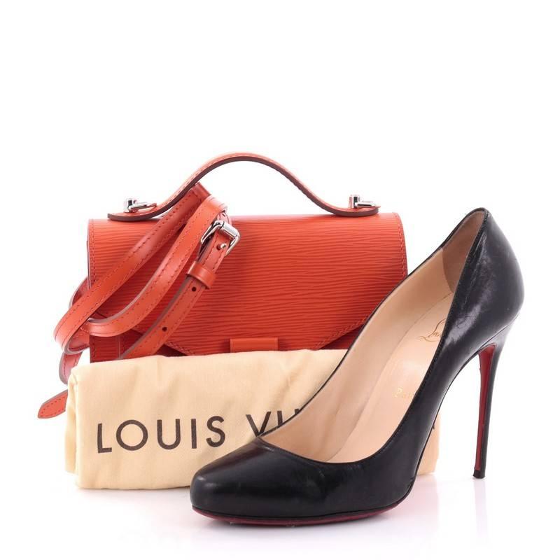 This authentic Louis Vuitton Monceau Handbag Epi Leather BB is cute and feminine bag with a vintage touch. Crafted from orange epi leather, this chic bag features leather top handle, adjustable long leather strap, gusseted pocket under flap, sleek