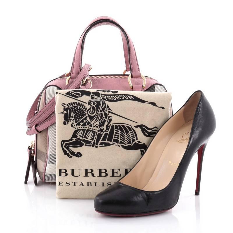 This authentic Burberry Alchester Convertible Satchel House Check Canvas Small is sophisticated yet classic in design perfect for everyday use. Crafted from Burberry's house check canvas, this petite satchel features pink leather trims and handles,
