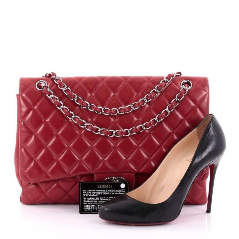 This authentic Chanel Classic Single Flap Bag Quilted Lambskin Maxi is a timeless essential for any modern woman. Crafted in red quilted lambskin leather, this classic flap features woven-in leather chain strap, exterior back pocket, CC signature