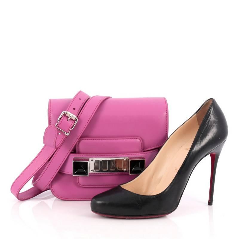 This authentic Proenza Schouler PS11 Crossbody Bag Leather Tiny is a staple among fashionistas. Constructed in pink leather, this petite bag features detachable and adjustable shoulder strap, faceted cubes, fastening grill closure and silver-tone