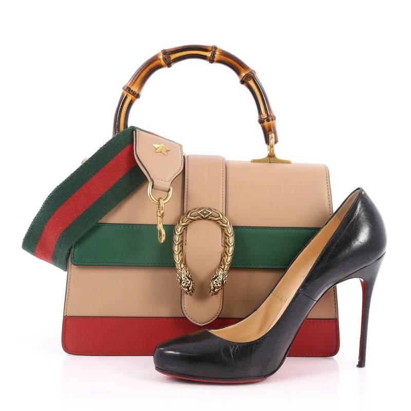 This authentic Gucci Dionysus Bamboo Top Handle Bag Colorblock Leather Medium named after the Greek god of wine is an easy to carry everyday bamboo top handle bag that is both stylish and functional. Crafted from nude, green and red leather, this