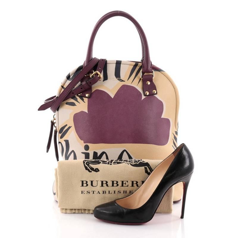 This authentic Burberry Bloomsbury Satchel Printed Leather Medium is a signature look that showcases a one-of-a-kind runway ready design ideal for everyday use. Crafted from blue, off white, yellow and purple printed leather, this unique tall dome