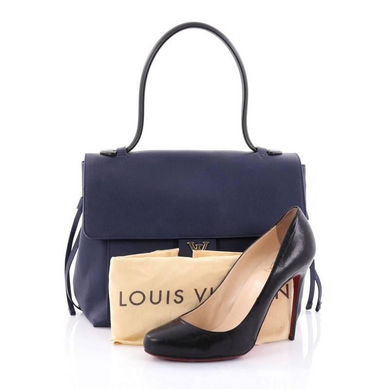 This authentic Louis Vuitton Lockme Handbag Leather PM is a must-have signature satchel made for the modern woman. Crafted in blue leather, this sophisticated yet feminine bag features a long leather top handle, side leather laces that cinches the