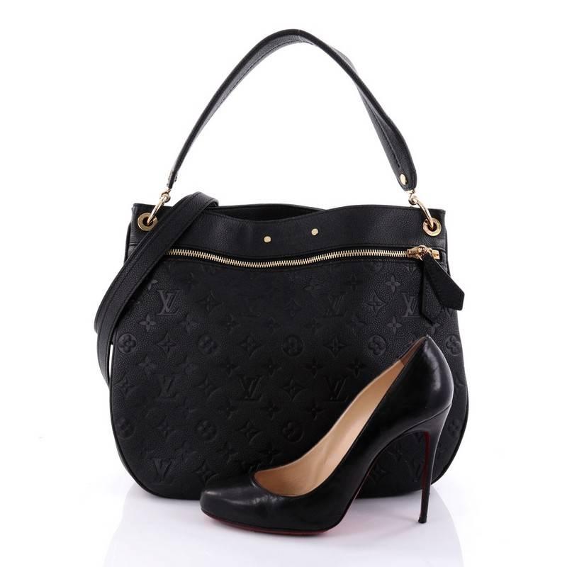 This authentic Louis Vuitton Spontini NM Handbag Monogram Empreinte Leather is a sporty and feminine bag, specifically crafted for the urban lifestyle. Crafted from black monogram empreinte leather, this lightweight bag features flat leather