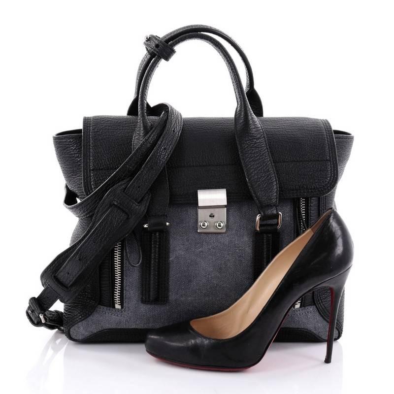 This authentic 3.1 Phillip Lim Pashli Satchel Leather with Denim Medium is a practical bag with a stylish edge made for on-the-go moments. Crafted from denim with black leather, this chic satchel features dual top handles, expandable zip sides, top
