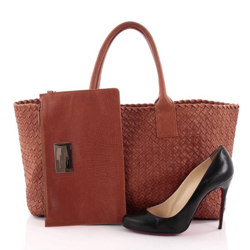 This authentic Bottega Veneta Cabat Tote Intrecciato Nappa Medium is a statement piece you can surely take from day to night. Beautifully crafted in burnt orange leather in Bottega Veneta's signature intrecciato woven method, this oversized stylish