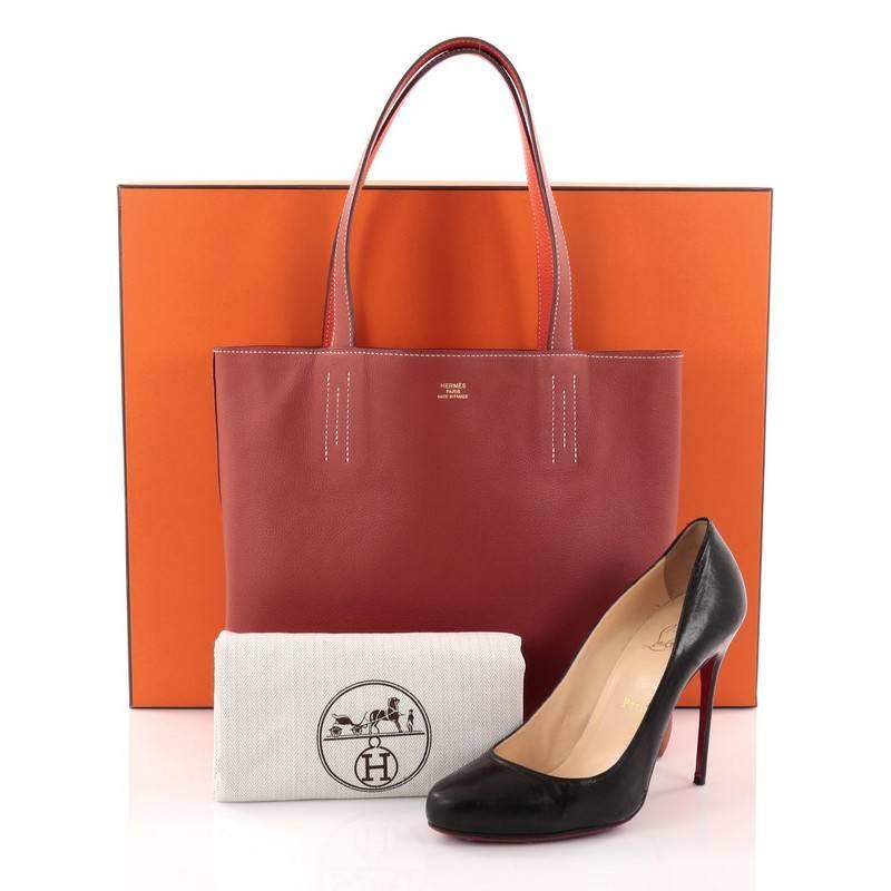 This authentic Hermes Double Sens Tote Clemence and Swift 36 combines a simple and functional style from Hermes perfect for everyday use. Crafted from Rouge Pivoine swift and Sanguine clemence leather, this reversible tote features all-around white