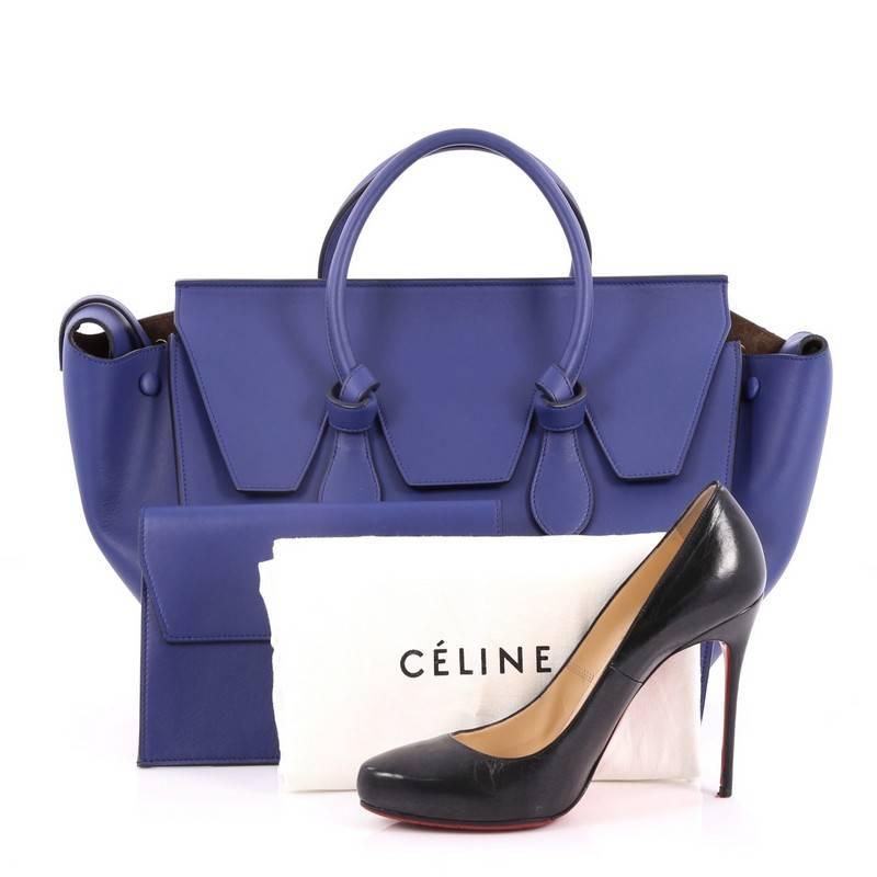 This authentic Celine Tie Knot Tote Smooth Leather Small is an absolute must-have for modern fashionistas. Crafted from blue smooth leather, this boxy chic tote features dual-rolled leather handles with signature knot accents, protective base studs,