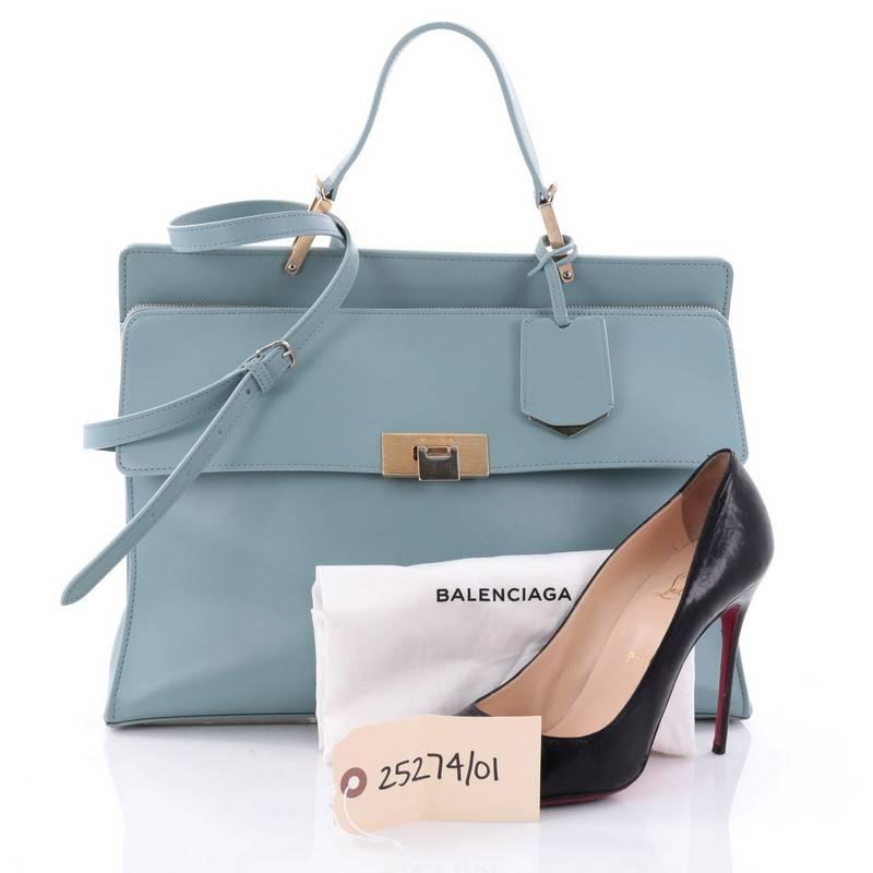 This authentic Balenciaga Le Dix Zip Cartable Top Handle Bag Leather Medium is an iconic and timeless bag beloved by many. Crafted from light blue leather, this stylish bag features top leather handle, detachable shoulder strap, snap closure with