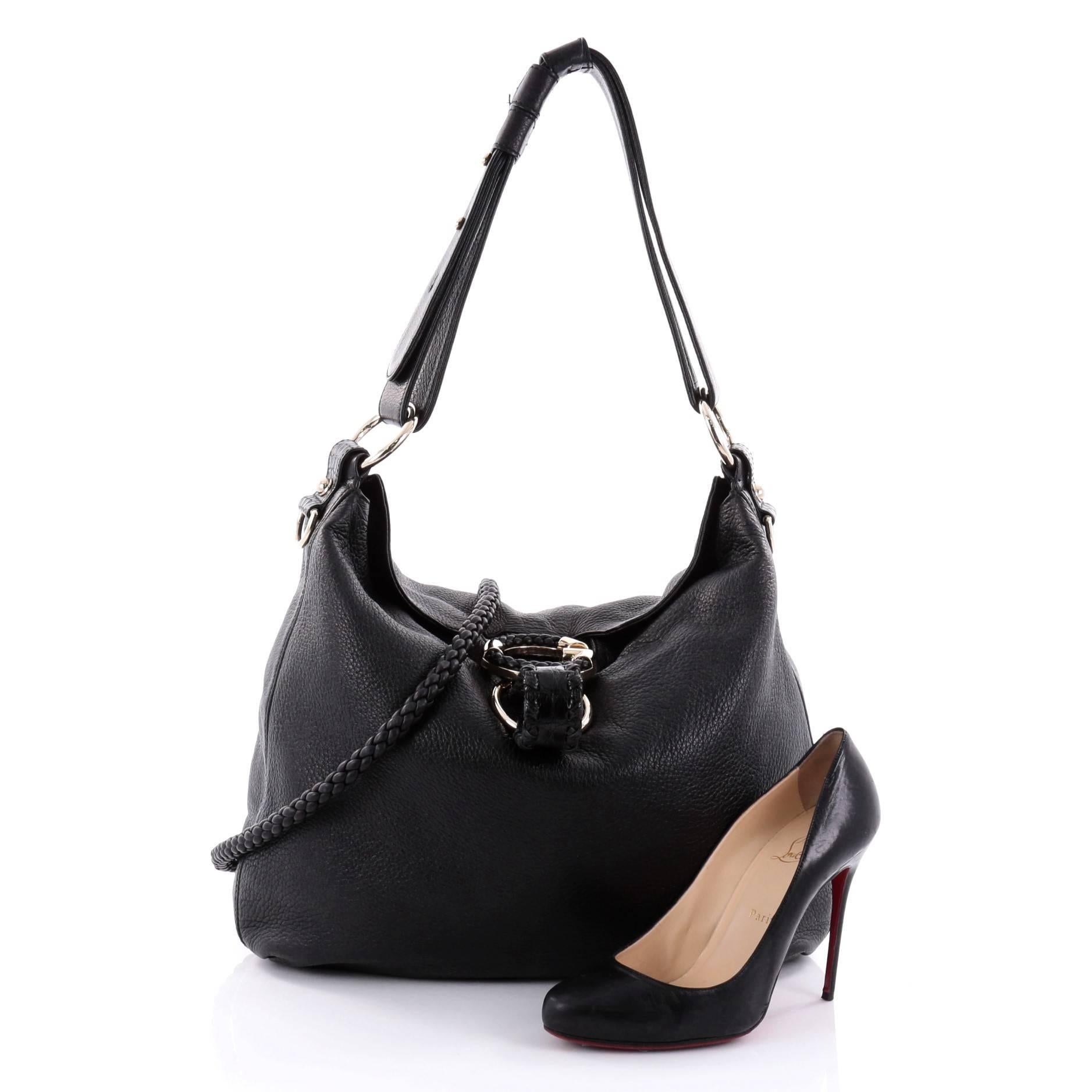This authentic Gucci G Wave Hobo Leather Medium is a marvelous shoulder bag for everyday use. Crafted from black leather, this super-chic shoulder bag features looping leather shoulder strap, detachable woven leather strap, G ornament with woven