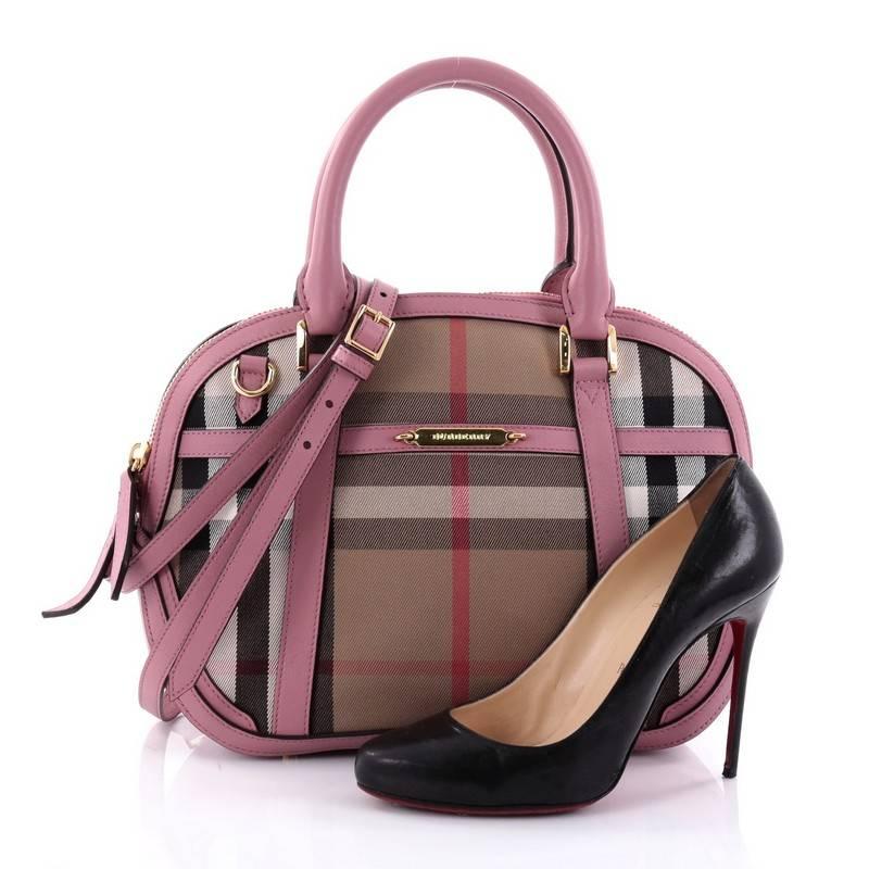 This authentic Burberry Bridle Orchard Bag House Check Canvas Medium has an elegant and simplistic design with a compact silhouette that is ideal for everyday use. Crafted from Burberry house check canvas with lilac leather trims, this bag features
