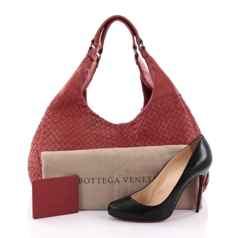 This authentic Bottega Veneta Campana Hobo Intrecciato Nappa Large is both understated yet elegant perfect for the modern woman. Crafted in Bottega Veneta's signature intrecciato woven burned orange nappa leather, this functional shoulder bag
