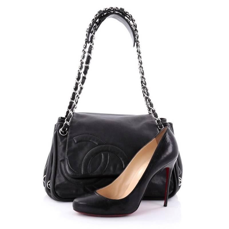 This authentic Chanel Diagonal CC Ligne Accordion Flap Bag Lambskin Medium is the perfect polished bag for a day or evening look. Crafted in black lambskin leather, this stylish bag features woven-in leather silver chain straps, oversized stitched