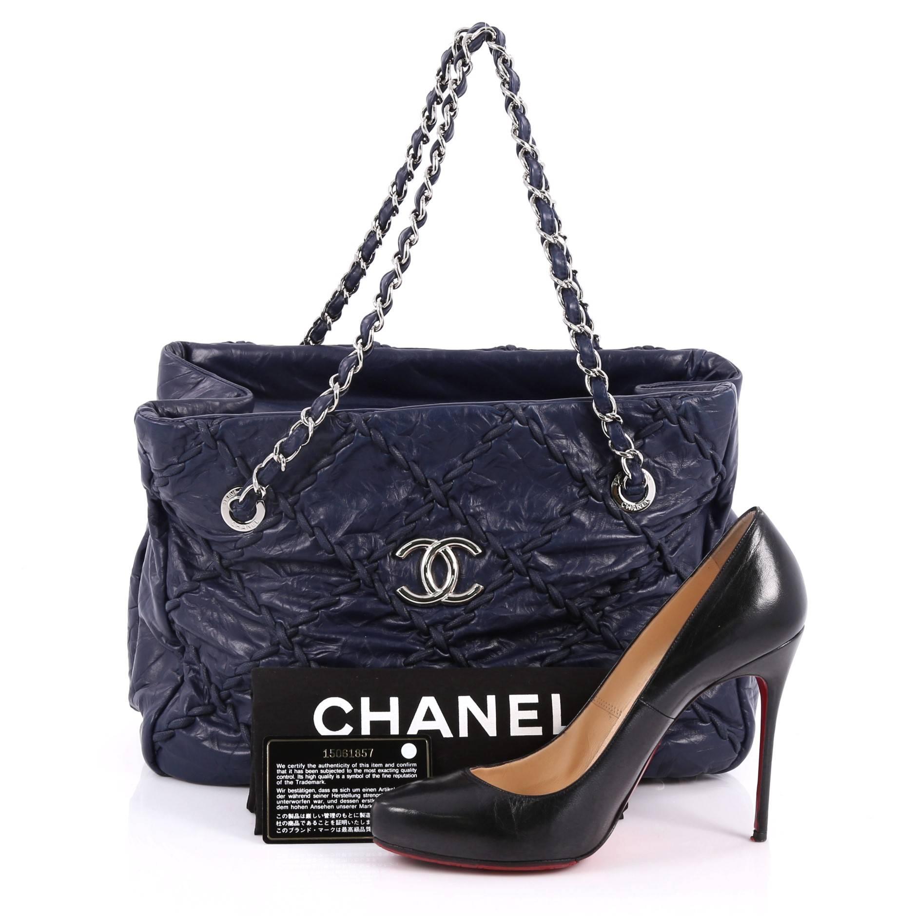 This authentic Chanel Ultra Stitch Chain Tote Leather is a must for any collection. Crafted from blue quilted leather, this subtly eye-catching tote bag features oversized diamond leather stitching details, CC interlocking logo on the front, dual