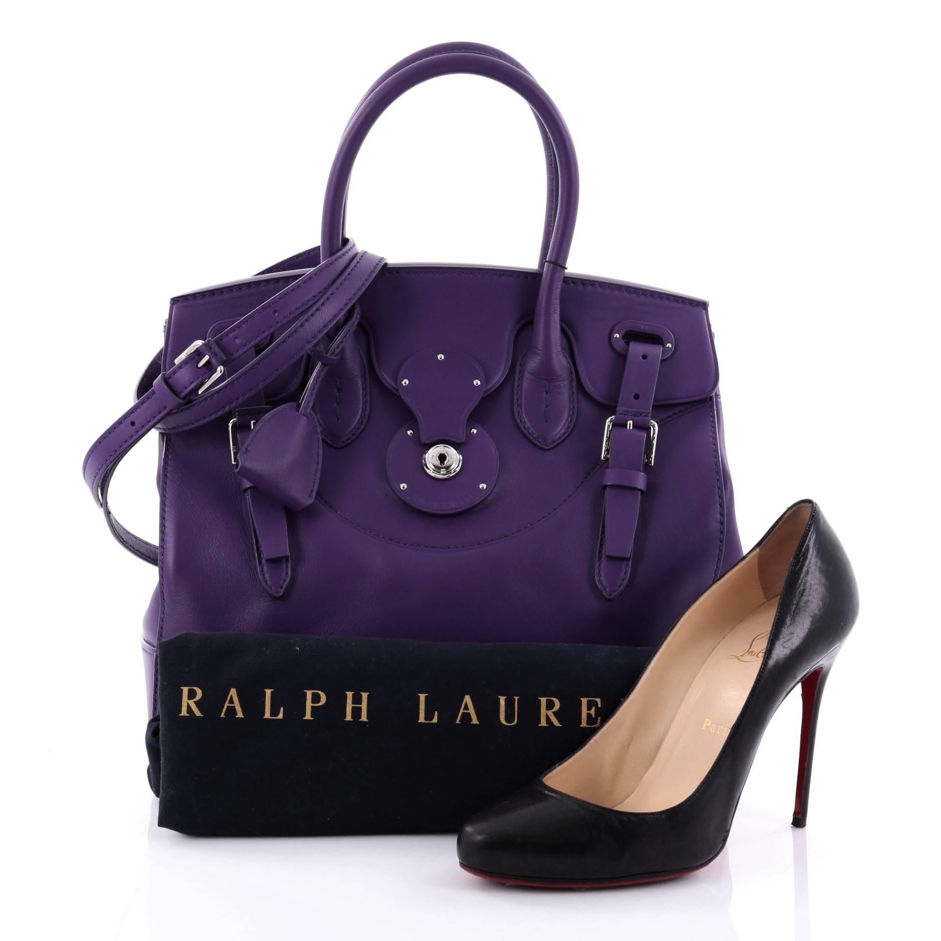 This authentic Ralph Lauren Collection Soft Ricky Handbag Leather 33 is one of the brand's most beloved styles. Crafted from purple leather, this understated, elegant tote features a boxy silhouette, a folded top with a slide-lock clasp and belted