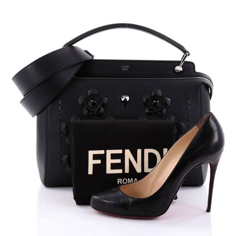This authentic Fendi DotCom Convertible Satchel Flower Studded Leather Medium is a chic and minimalist bag perfect for your everyday looks. Crafted from black leather with ABS studded Flowerland flower appliqués, this understated satchel features a